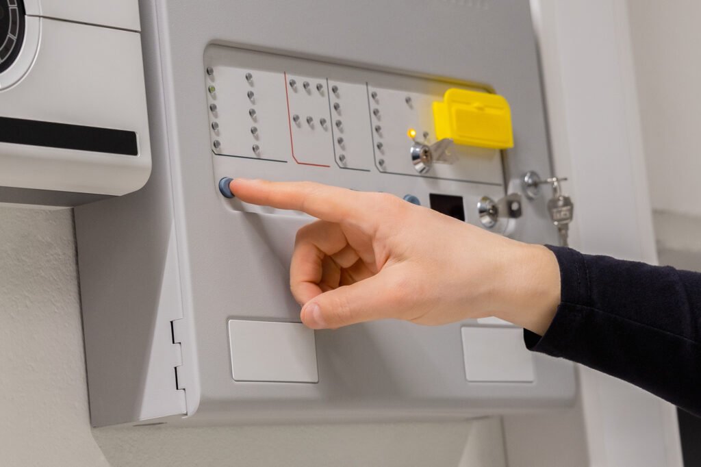 fire technician checking panel