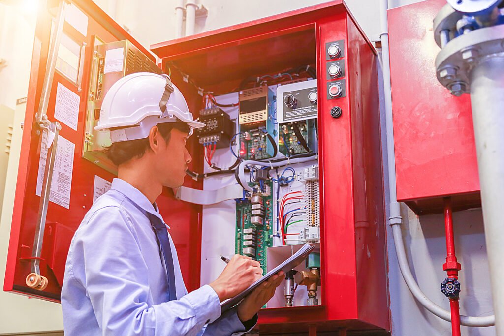 Fire & Security Engineer Inspeciting Panel